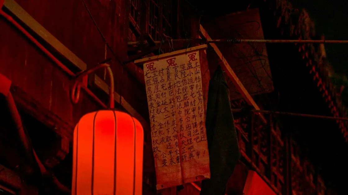 Red lanterns lighting an old street at night