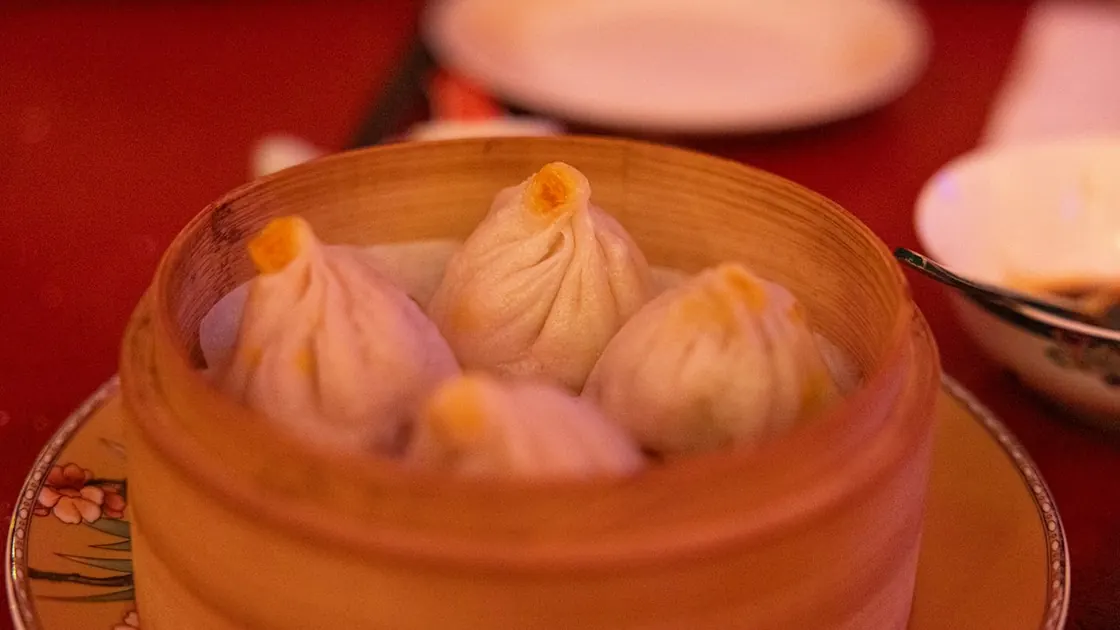 Soup dumplings in a bamboo steamer